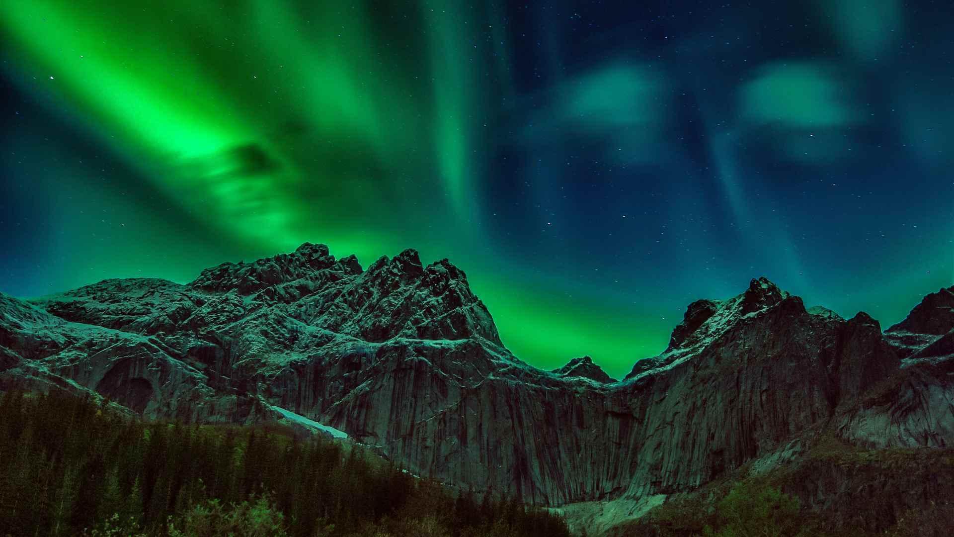 Breathtaking View of a Landscape and the Aurora