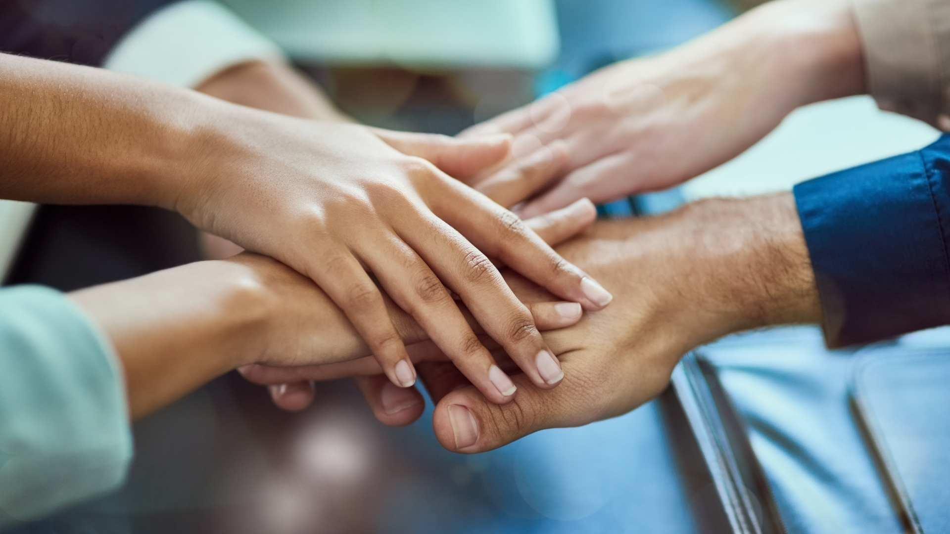 diverse hands on top of each other