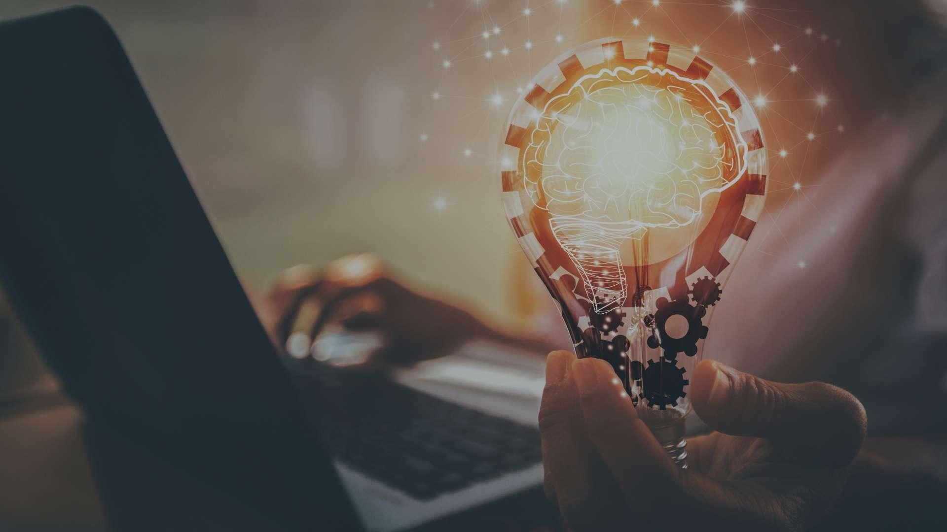 person holding light bulb as idea concept