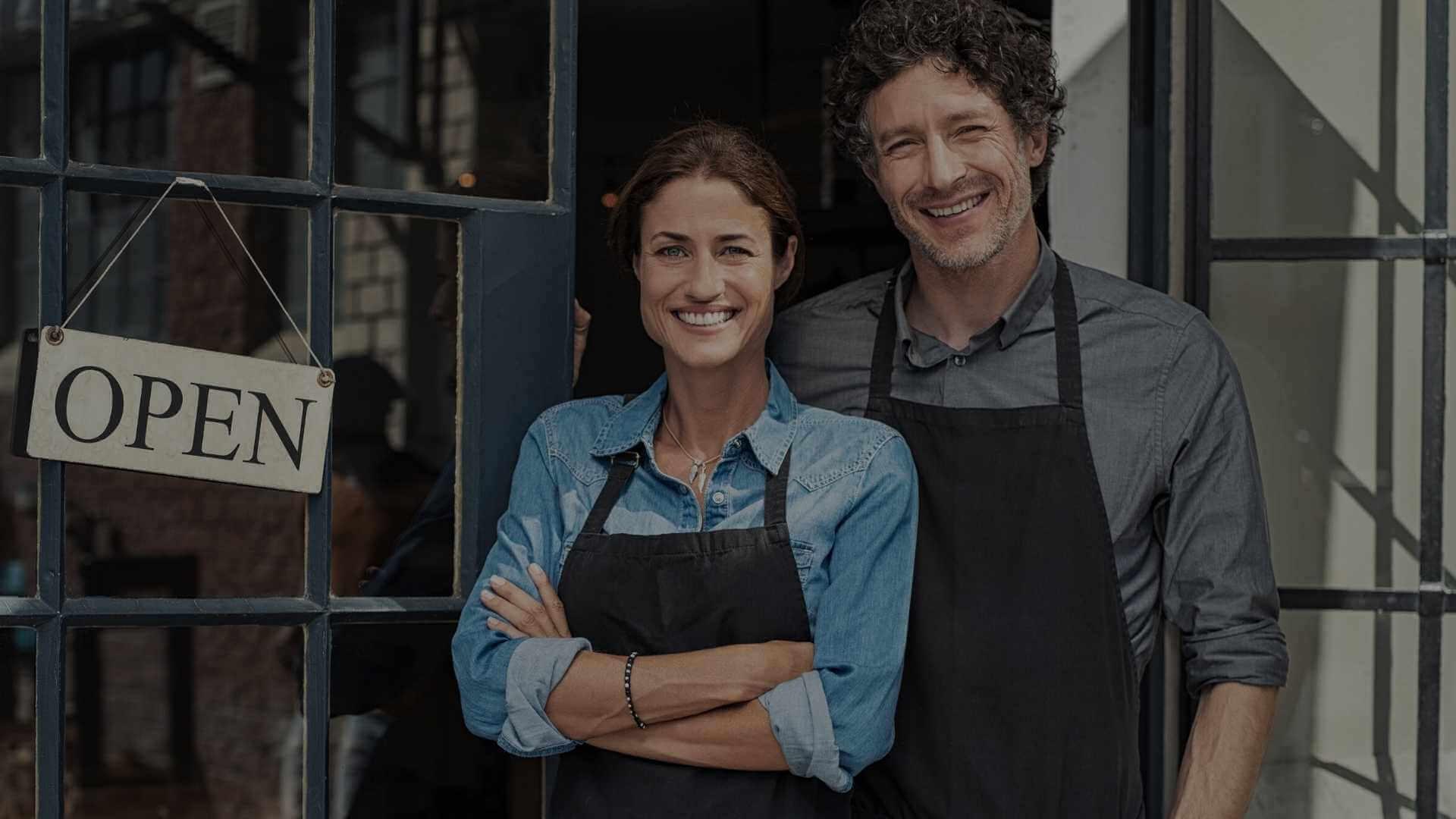 business owner in the front of their store