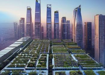 An aerial perspective of a vertical city skyline, featuring high-rise buildings with integrated gardens and solar panels, all bathed in soft blue lighting against a twilight sky