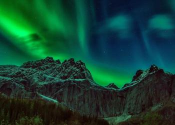 Breathtaking View of a Landscape and the Aurora