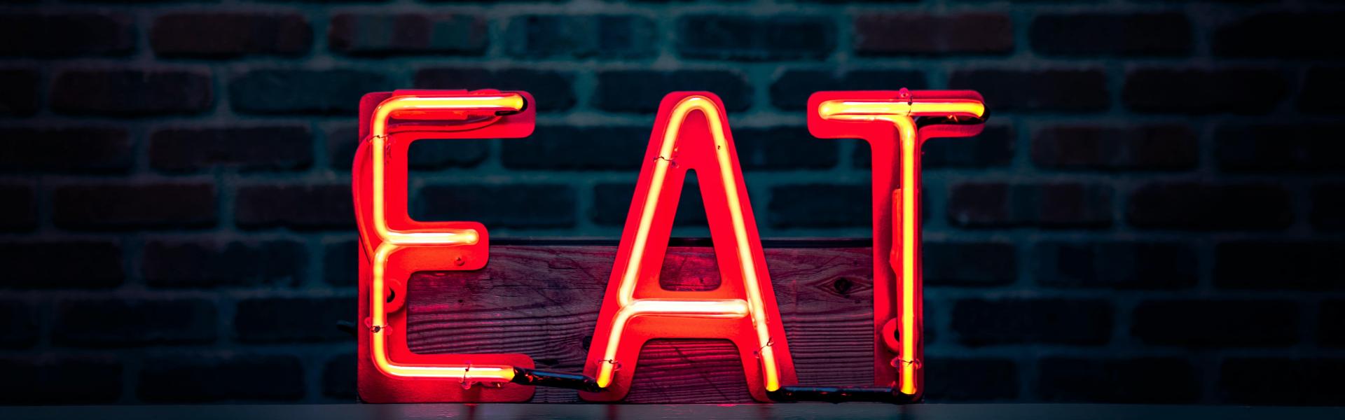E-A-T sign hanging at a rest wall
