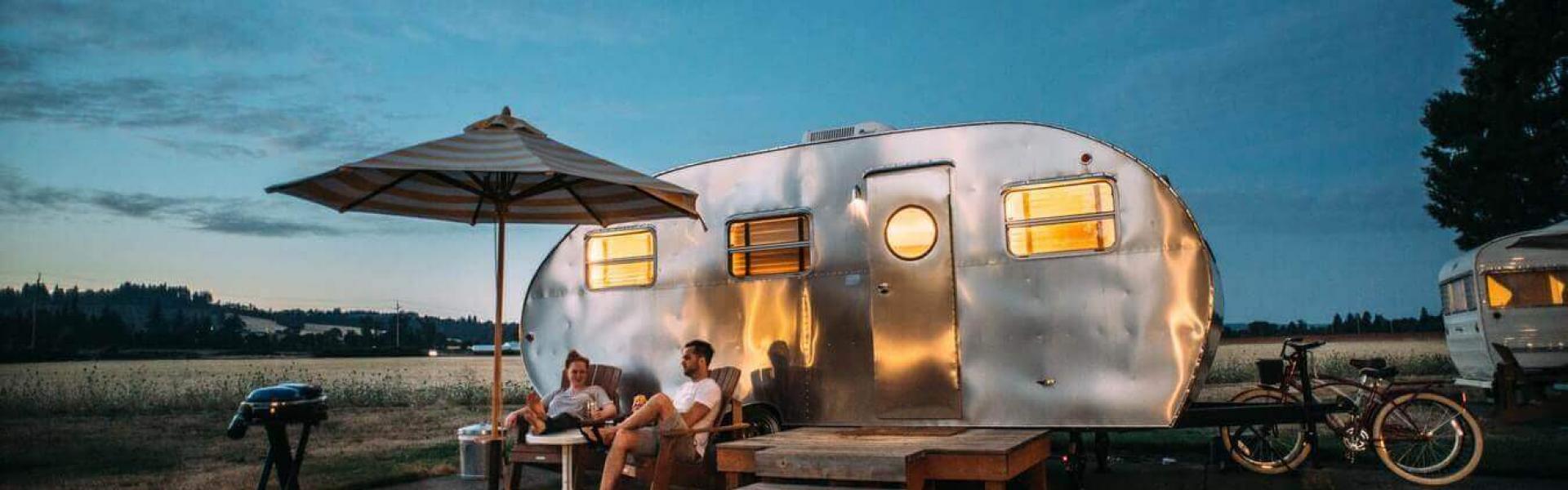Group of people sitting in front of their RV
