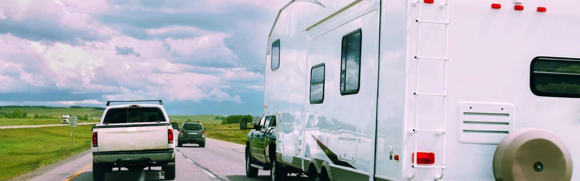 pick up truck next to an RV
