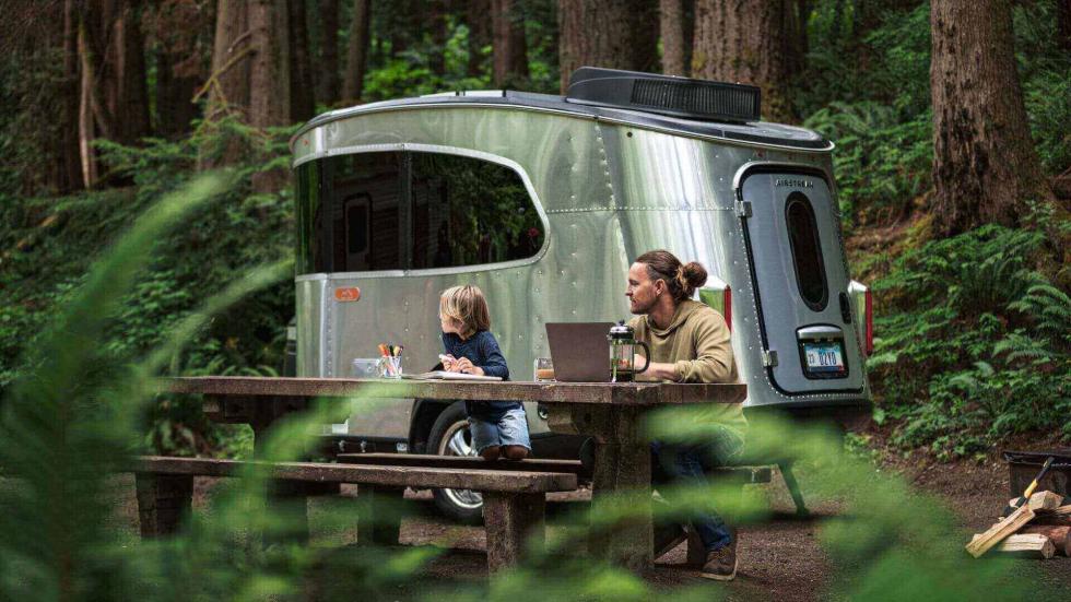 father and son behind Airstream Basecamp Travel Trailer