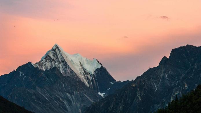 snowed mountains on a sunset