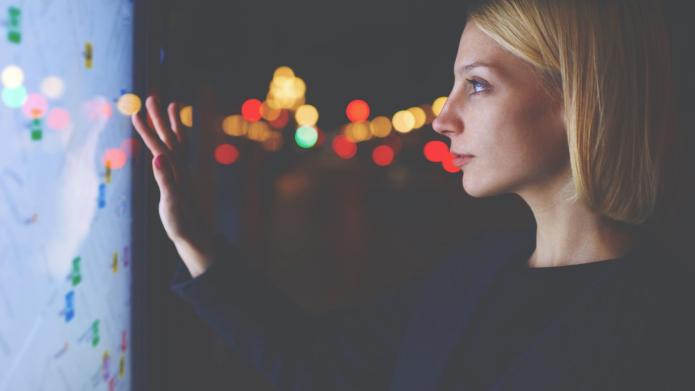 young female using smart city gadget